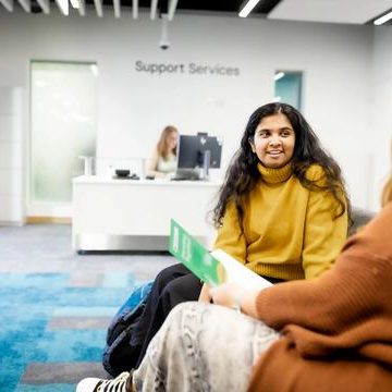 An image of a 1-2-1 consultaiton in the support services area.